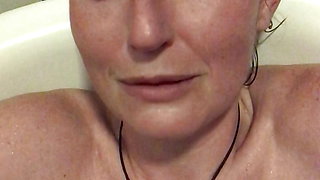 Hot step-mom masturbating with a vibrator in the bath and the orgasmic aftermath