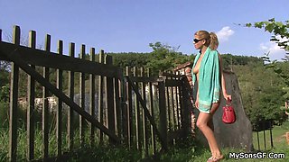 Old man toying teen girl outdoors