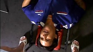 Two service technicians drill pretty brunette in the garage