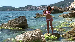 Brunette takes off her lingerie outdoor