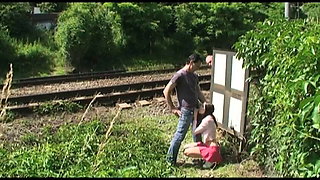 A voyeur spies two young men fucking by the train tracks