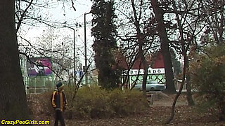 Young chick peeing in the park