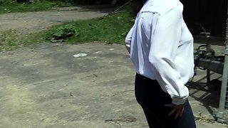 Outdoor solo masturbation scene with curly blonde