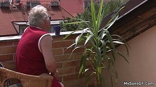 Horny granpa fucks younger woman on the roof