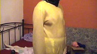 I help my wife to put a latex straitjacket on and tie her up