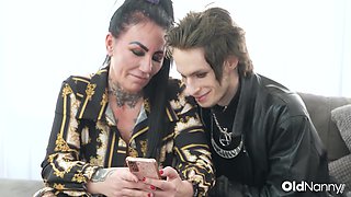 Inked Mature With Big Tits Gives Blowjob To Emo Stud