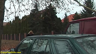 Girl peeing between the cars