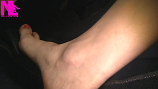 Nyllady with Her Bare Foot on Gas Pedal Driving