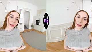 A sexy girl with long hair plays with her pussy in shorts