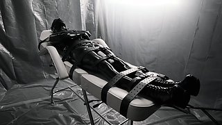 Freaky babe in latex gets restrained and made to cum hard
