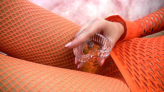 Babe in fishnet outfit rips pantyhose and puts a dildo in her shaved cunt