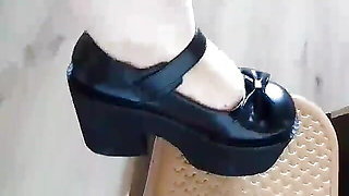 Black gothic heels at home