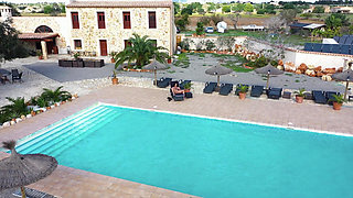 Hot Ilona Lies by the Pool and Rubs Her Pussy and Dildo with Oil