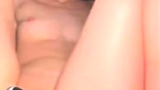 Cute amateur teen girl toying her pussy in bed on cam