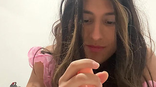 Natalia Valera uses her mouth to put a condom on her dildo and rides it