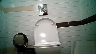 Women pee in public toilet 2414