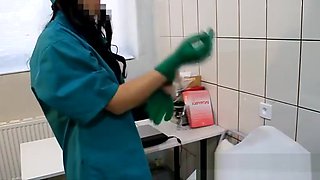 Brunette nurse masturbates in the doctor's office