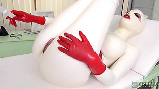 Costumed girl Latex Lucy masturbates using her fingers and sex toys