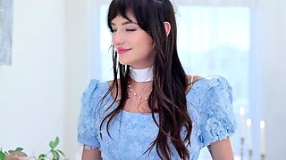 In a kitchen a sexy brunette playing with her big boobs