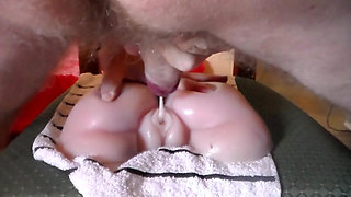 John is fucking a fake pussy and cums on it