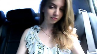Enticing camgirl puts her lovely tits on display in the car