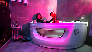 Mistress' Taking a Bath in Latex and Boots