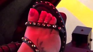 Brunette with foot fetish rubs big dick with her feet in POV