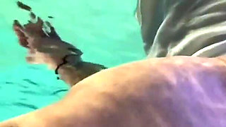 Amazon Kandy Flexes Her Massive Biceps in Her Hotel Pool