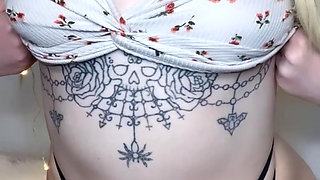 amateur tattooed blonde oils her pierced tits