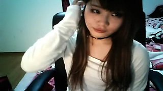 Chinese girl piercing her nipple on webcam
