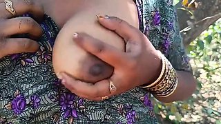 Lactating busty Indian milf milks her nipples outdoors