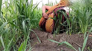 Desi 18-year-old married bhabhi fingers her wet pussy in the field, then brother fucks her tight butt outdoors