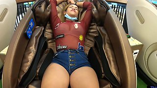Asian babe flaunts phony boobies in skimpy attire while getting a naughty hand job under the sun