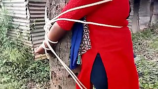 indian girl tied to a tree