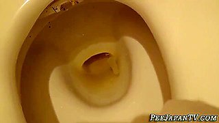 Asian Young Babe Pees In Toilet