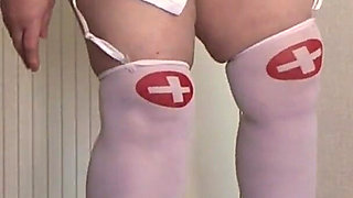 A Mature Nurse in a Photo Shoot Behind the Scenes. a Busty BBW with a Big Ass in a Medical Uniform.