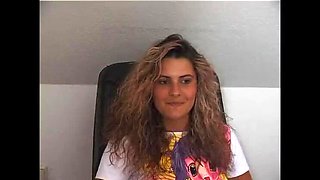 Gorgeous curly haired babe shows off her round ass and masturbates solo on camera