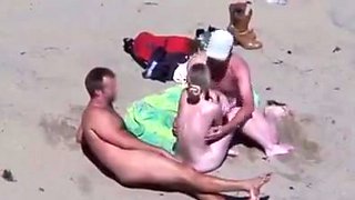 Cuckold couple on the beach