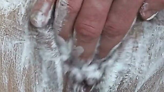 Close-up of Shaving the Vagina with a Trimmer and a Razor