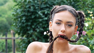 Pigtailed beauty Vixi Rafi fingering herself in a field