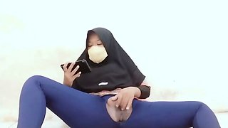 Indonesian hijab aunt wearing cucumber