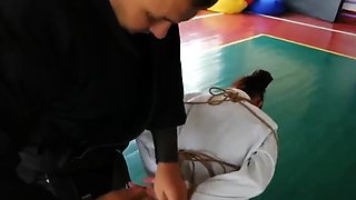 Master ties up his sexy martial arts student in rope!