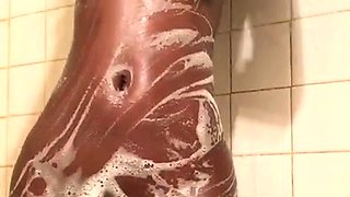 Sexy amateur chick taking a shower and masturbating