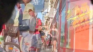 Street cam catches a scantly clad girl shopping